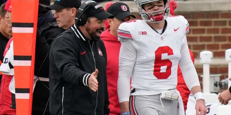 Nov 25, 2023; Ann Arbor, Michigan, USA; Ohio State Buckeyes head coach Ryan Day talks to quarterback Kyle McCord (6) on the sideline during the second half of the NCAA football game against the Michigan Wolverines at Michigan Stadium. Ohio State lost 30-24.