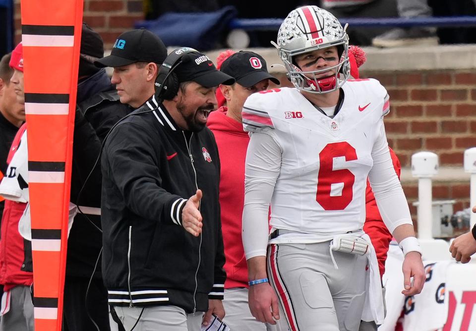 Nov 25, 2023; Ann Arbor, Michigan, USA; Ohio State Buckeyes head coach Ryan Day talks to quarterback Kyle McCord (6) on the sideline during the second half of the NCAA football game against the Michigan Wolverines at Michigan Stadium. Ohio State lost 30-24.