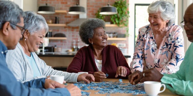 A group of older adults doing a puzzle.