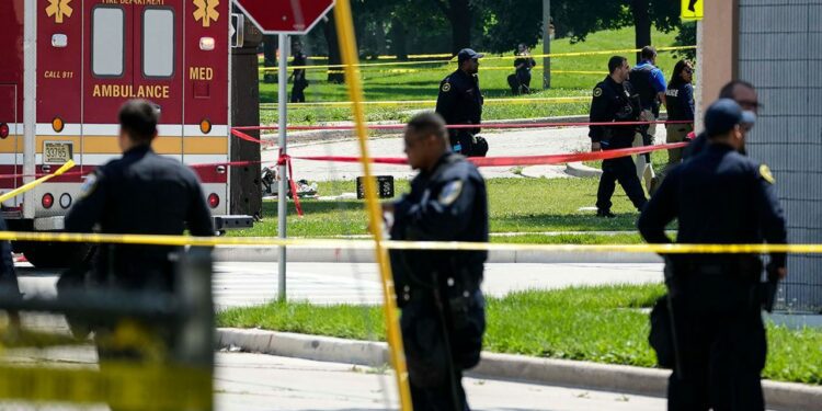 Police investigate a shooting near King Park in Milwaukee on Tuesday, July 16. The shooting occurred outside of the security perimeter for the Republican National Convention.