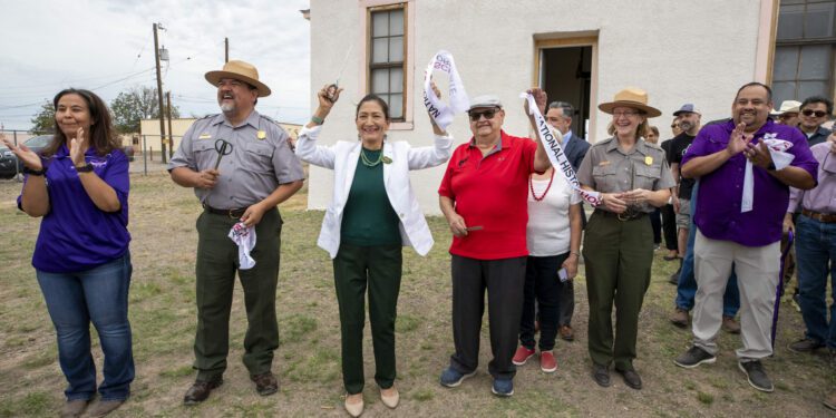 Secretary of the Interior Deb Haaland, center left, Blackwell School alumni Joe Cabezuela, center r...