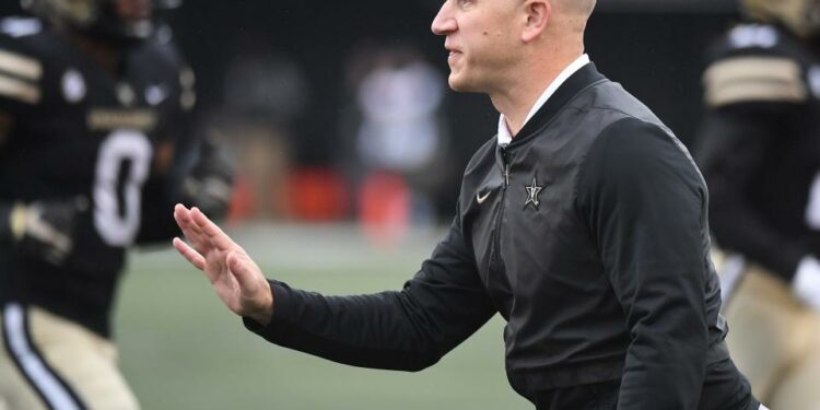 Oct 30, 2021; Nashville, Tennessee, USA; Vanderbilt Commodores head coach Clark Lea talks with an official during the first half against the Missouri Tigers at Vanderbilt Stadium. Mandatory Credit: Christopher Hanewinckel-USA TODAY Sports