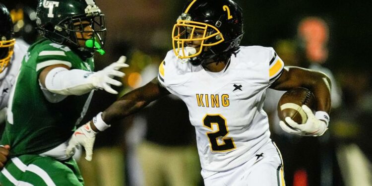 Detroit King running back Michael Dukes (2) runs against Cass Tech during the first half at Cass Tech High School in Detroit on Friday, Sept. 20, 2024.