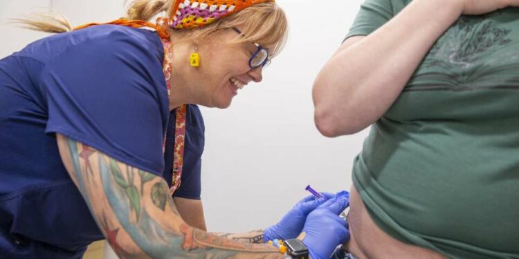 Certified clinical medical assistant Chelsea Morning gives an intra-articular birth control shot to a patient Aug. 30 at a Planned Parenthood clinic in Mankato, Minn. Planned Parenthood provides services at the Mankato location including wellness exams, medication abortions, birth control and family planning services. (Savannah Blake/The Gazette)