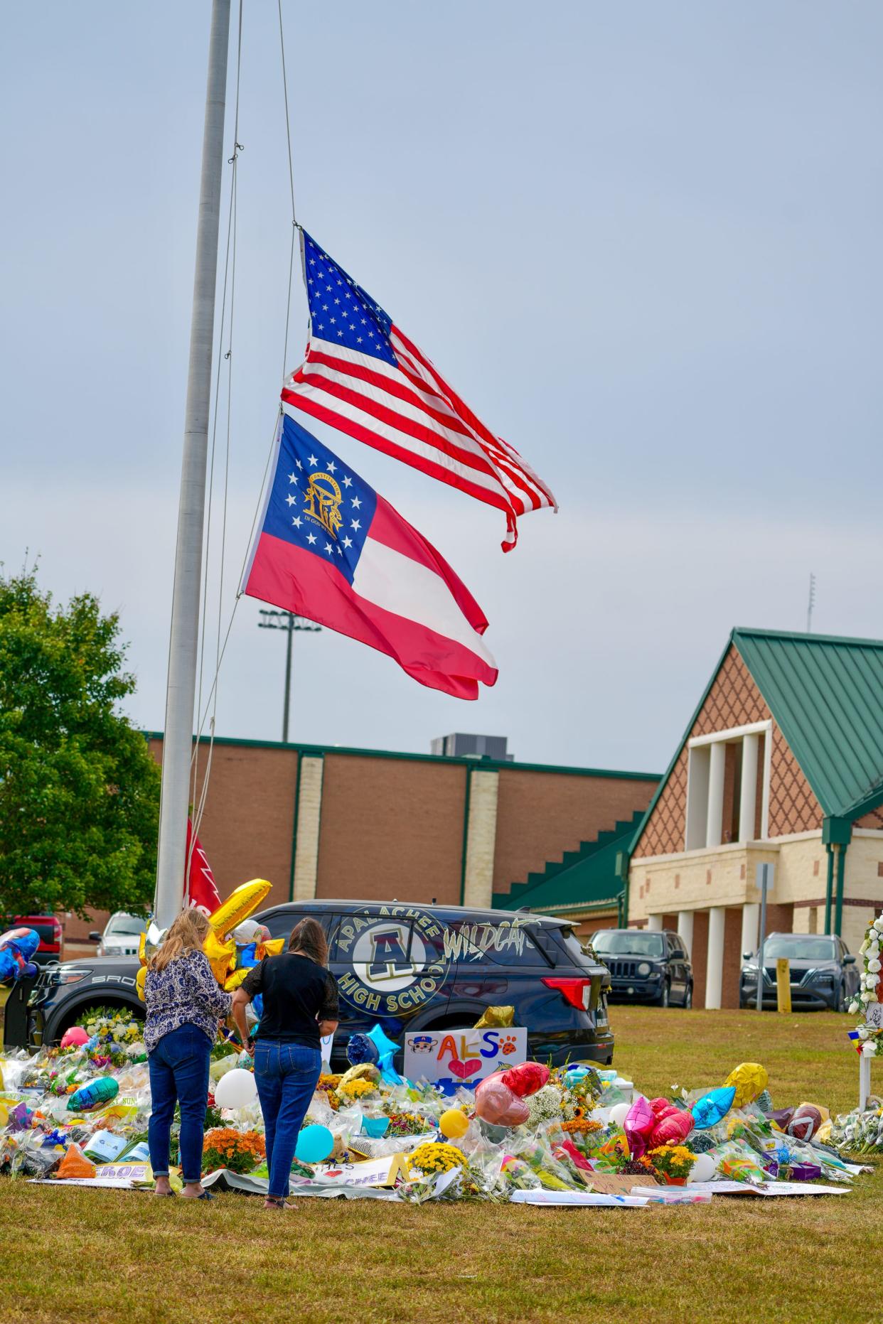 A week after the incident, mourners visit a memorial to the victims of the Apalachee High School shooting in Barrow County, Georgia, on Sept. 11, 2024.