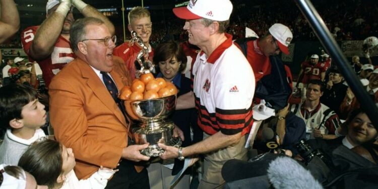 2 Jan 1998: Head coach Tom Osbourne of the Nebraska Cornhuskers holds a trophy after the Orange Bowl against the Tennessee Volunteers at Pro Player Stadium in Miami, Florida. Nebraska won the game, 42-17.