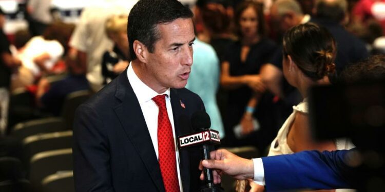 U.S. Senate candidate Bernie Moreno speaks to reporters before a rally for Ohio Sen. JD Vance at Middletown High School in July.