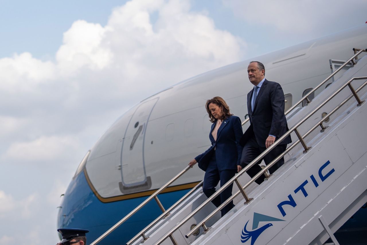 Vice President Kamala Harris and her husband second gentleman Doug Emhoff arrive at Philadelphia International Airport for a campaign event at the Liacouras Center at Temple University on August 6 in Philadelphia.