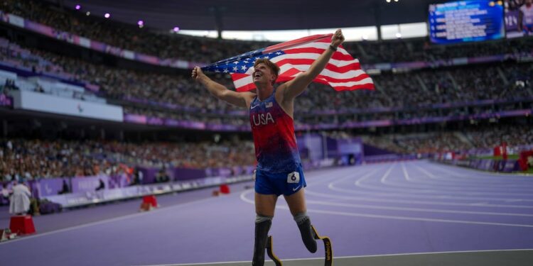 Hunter Woodhall from the U.S. celebrates after winning the men's 400 m. T62 final at the 2024...