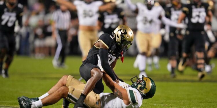 Sep 16, 2023; Boulder, Colorado, USA; Colorado State Rams defensive back Henry Blackburn (11) makes an interception on a pass intended for Colorado Buffaloes wide receiver Jimmy Horn Jr. (5) in the first quarter at Folsom Field. Mandatory: Andrew Wevers-USA TODAY Sports