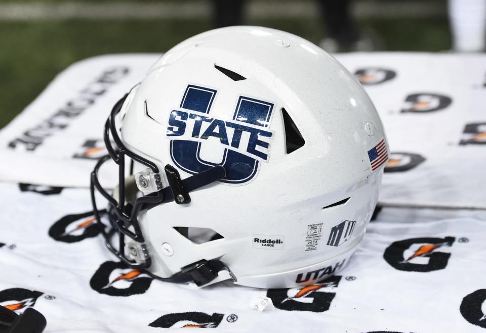 Sep 4, 2021; Pullman, Washington, USA; Utah State Aggies helmet sits during a game against the Washington State Cougars in the second half at Gesa Field at Martin Stadium. The Aggies26-23. Mandatory Credit: James Snook-USA TODAY Sports