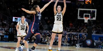 Caitlin Clark leads Iowa rally for a 71-69 win over UConn, setting up a title game against unbeaten South Carolina