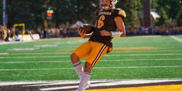 Sep 30, 2023; Laramie, Wyoming, USA; Wyoming Cowboys quarterback Andrew Peasley (6) scores a touchdown against the New Mexico Lobos during the first quarter at Jonah Field at War Memorial Stadium. Mandatory Credit: Troy Babbitt-USA TODAY Sports