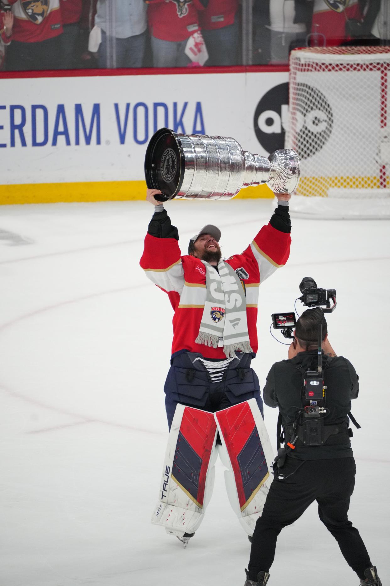 Jun 24, 2024; Sunrise, Florida, USA; goaltender Sergei Bobrovsky (72) hoists the Stanley Cup after defeating Edmonton Oilers in game seven of the 2024 Stanley Cup Final at Amerant Bank Arena. Mandatory Credit: Jim Rassol-USA TODAY Sports