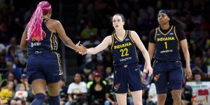 May 3, 2024; Dallas, Texas, USA; Indiana Fever guard Caitlin Clark (22) celebrates with Indiana Fever forward Aliyah Boston (7) during the second quarter against the Dallas Wings at College Park Center. Mandatory Credit: Kevin Jairaj-USA TODAY Sports