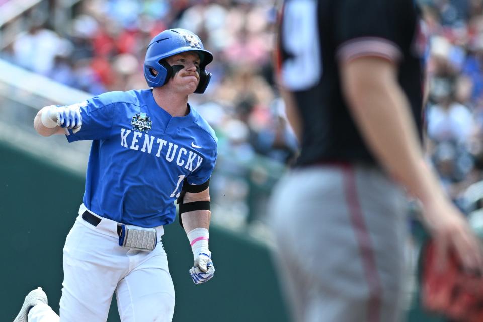 Jun 15, 2024; Omaha, NE, USA; Kentucky Wildcats center fielder Nolan McCarthy (19) celebrates hitting a home run against the NC State Wolfpack during the fourth inning at Charles Schwab Filed Omaha. Mandatory Credit: Steven Branscombe-USA TODAY Sports