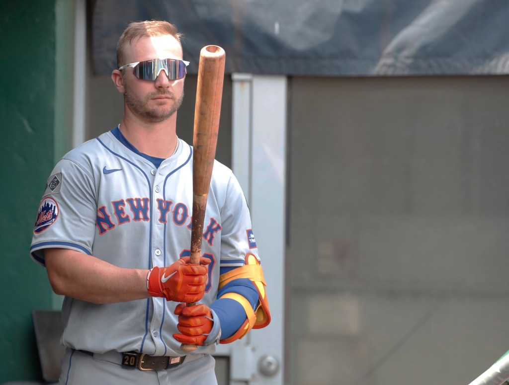 Pittsburgh, Pennsylvania, USA; New York Mets first baseman Pete Alonso (20) prepares in the dugout before batting against the Pittsburgh Pirates during the sixth inning at PNC Park. The Mets won 3-2.