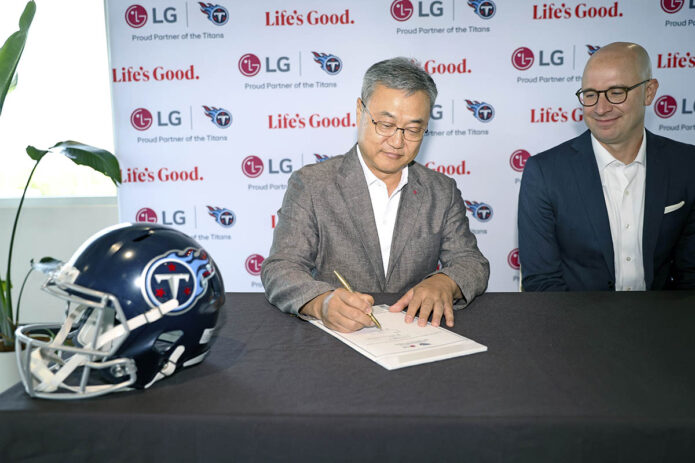 LG Electronics North America CEO Chris Jung and Titans Chief Operating Officer Daniel Werly sign a multi-year extension of their partnership, which will continue to focus on providing support to local businesses, driving economic growth and creating community programs and events on Monday, July 8, 2024 in Nashville, Tenn. (Davis Stevens/AP Content Services for LG Electronics USA) 