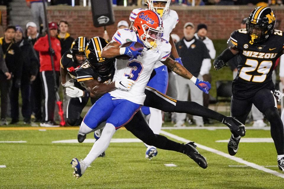 Nov 18, 2023; Columbia, Missouri, USA; Florida Gators wide receiver Eugene Wilson III (3) returns a kickoff as Missouri Tigers wide receiver Ja'Marion Wayne (25) makes the tackle during the second half at Faurot Field at Memorial Stadium. Mandatory Credit: Denny Medley-USA TODAY Sports