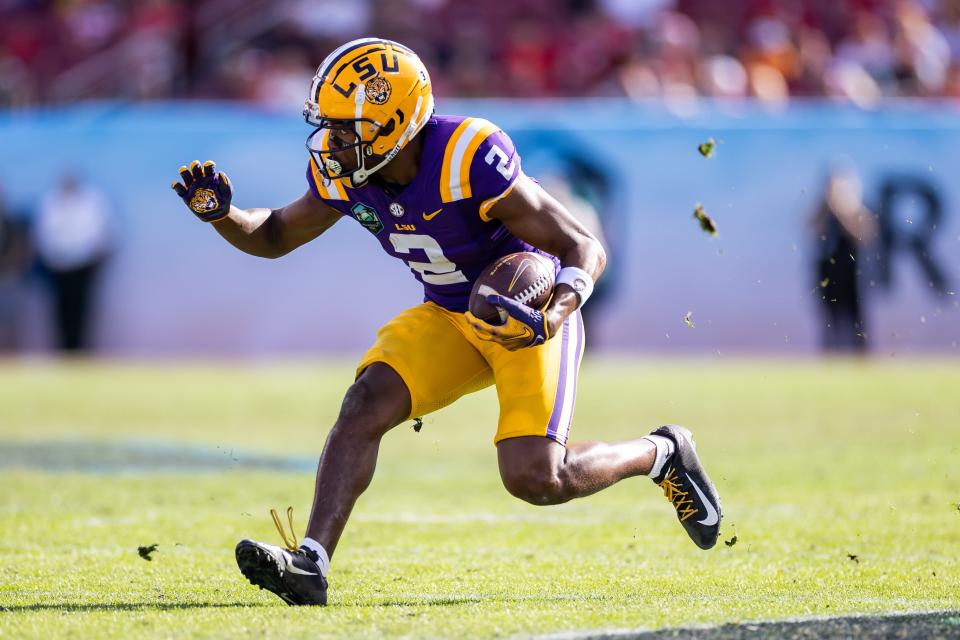 Jan 1, 2024; Tampa, FL, USA; LSU Tigers wide receiver Kyren Lacy (2) runs with the ball during the second half against the Wisconsin Badgers at the Reliaquest Bowl at Raymond James Stadium. Mandatory Credit: Matt Pendleton-USA TODAY Sports