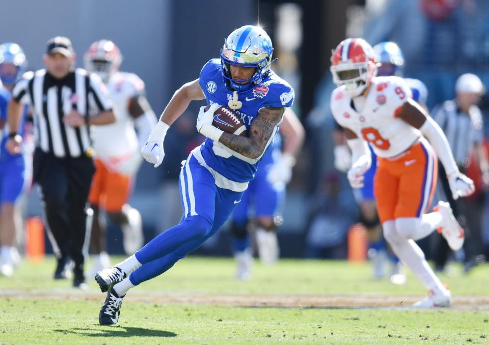 Kentucky Wildcats wide receiver Dane Key (6) runs with the ball on a pass play that took him to the 5-yard line during first quarter action. The Kentucky Wildcats faced off against the Clemson Tigers Friday, December 29, 2023, in the TaxSlayer Gator Bowl in Jacksonville, Florida. The Wildcats led 14 to 10 at the half. [Bob Self/Florida Times-Union]