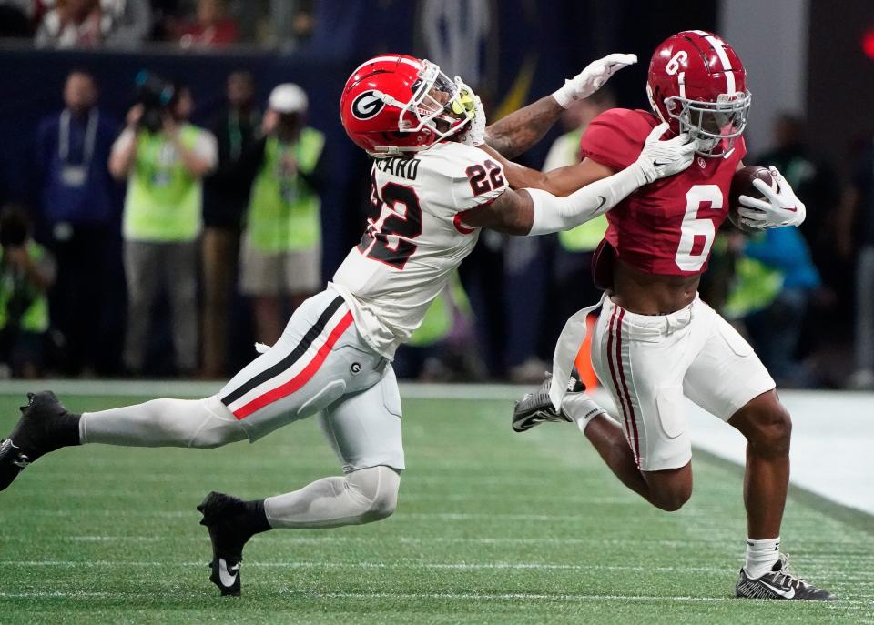 Dec 2, 2023; Atlanta, GA, USA; Alabama Crimson Tide wide receiver Kobe Prentice (6) is tackled by the facemark by Georgia Bulldogs defensive back Javon Bullard (22) at Mercedes-Benz Stadium. Mandatory Credit: Gary Cosby Jr.-USA TODAY Sports