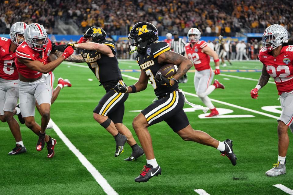 Dec 29, 2023; Arlington, Texas, USA; Missouri Tigers wide receiver Luther Burden III (3) runs upfield during the fourth quarter of the Goodyear Cotton Bowl Classic against the Ohio State Buckeyes at AT&T Stadium.