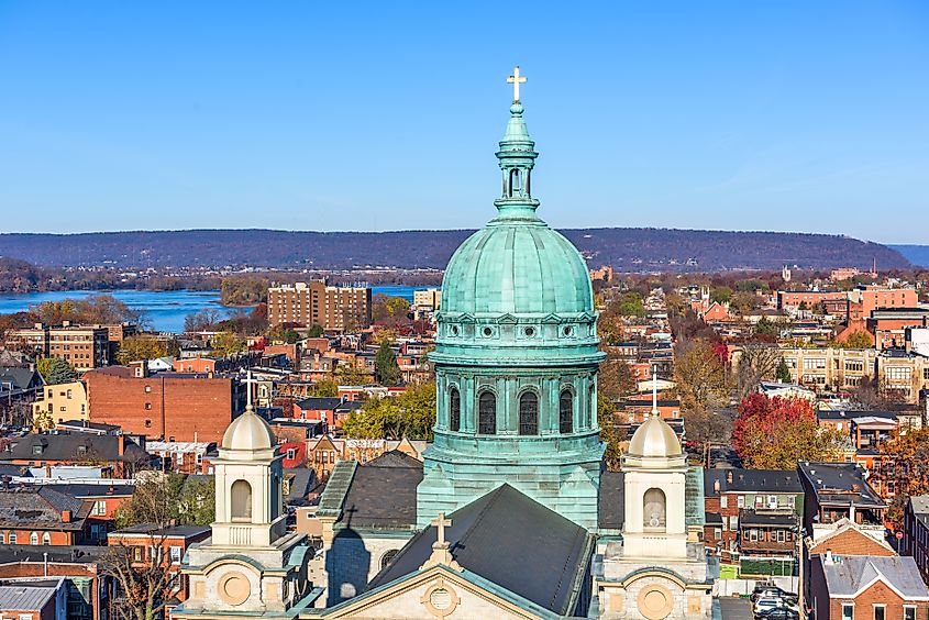 Cityscape of Harrisburg, Pennsylvania, USA featuring historic churches.