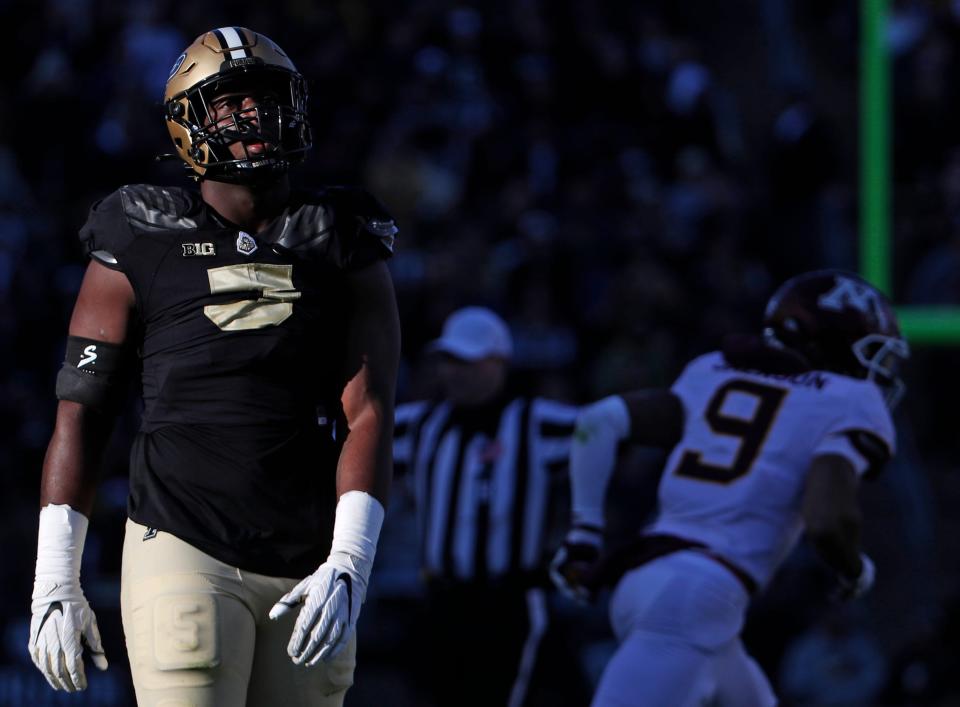 Purdue Boilermakers linebacker Nic Scourton (5) watches a replay on the scoreboard during the NCAA football game against the Minnesota Golden Gophers, Saturday, Nov. 11, 2023, at Ross-Ade Stadium in West Lafayette, Ind. Purdue Boilermakers won 49-30.