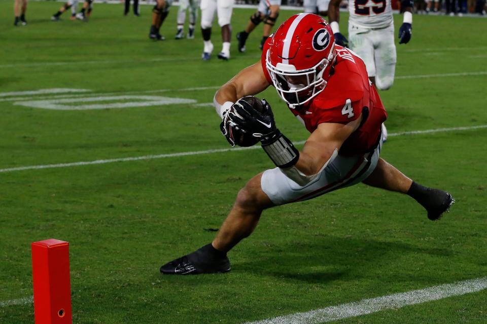 Georgia tight end Oscar Delp (4) drives in for a touchdown during the second half of a NCAA college football game against Tennessee Martin in Athens, Ga., on Saturday, Sept. 2, 2023. Georgia won 48-7.