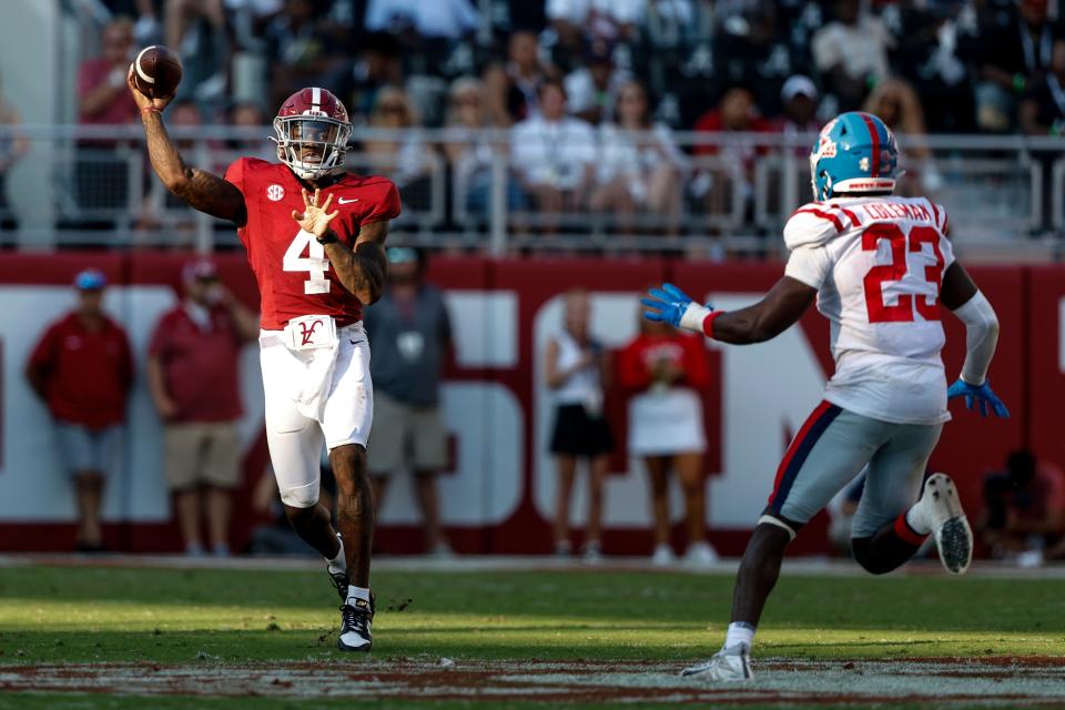 Sep 23, 2023; Tuscaloosa, Alabama, USA; Alabama Crimson Tide quarterback Jalen Milroe (4) throws a pass against the Mississippi Rebels during the second half of a football game at Bryant-Denny Stadium. Mandatory Credit: Butch Dill-USA TODAY Sports