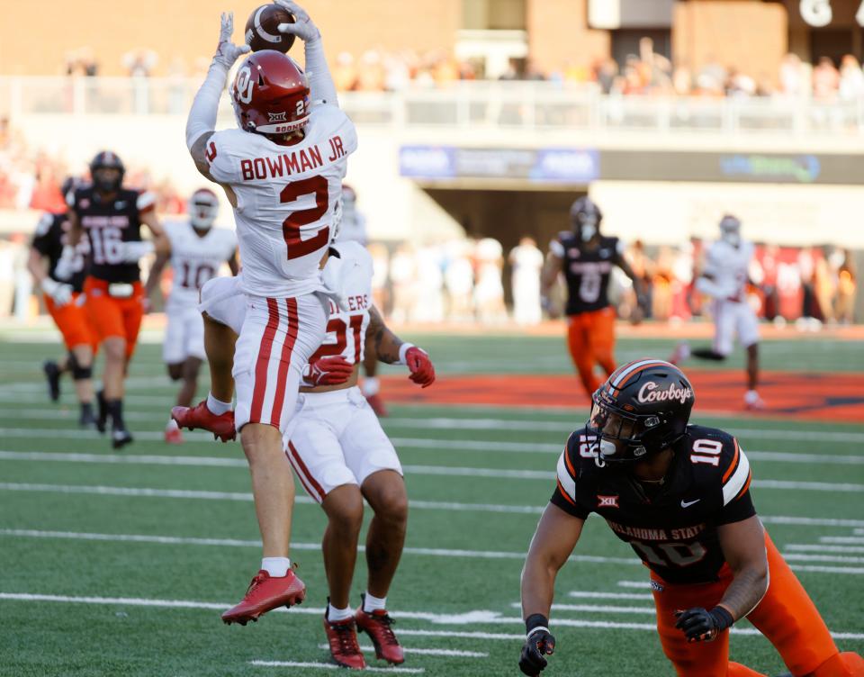 Oklahoma Sooners defensive back Billy Bowman Jr. (2) intercepts a pass beside Oklahoma State Cowboys wide receiver Rashod Owens (10) during a Bedlam college football game between the Oklahoma State University Cowboys (OSU) and the University of Oklahoma Sooners (OU) at Boone Pickens Stadium in Stillwater, Okla., Saturday, Nov. 4, 2023. Oklahoma State won 27-24.