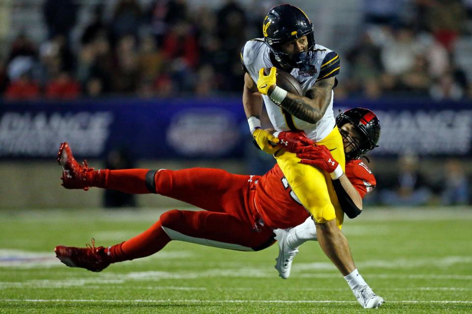 Dec 16, 2023; Shreveport, LA, USA; California Golden Bears running back Jaydn Ott (1) runs the ball as Texas Tech Red Raiders linebacker Ben Roberts (13) makes the tackle during the second half at Independence Stadium. Mandatory Credit: Petre Thomas-USA TODAY Sports