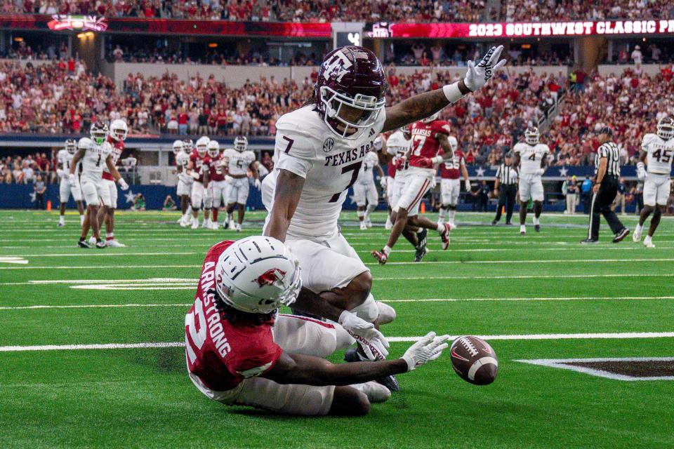 Sep 30, 2023; Arlington, Texas, USA; Texas A&M Aggies defensive back Tyreek Chappell (7) breaks up a pass intended for Arkansas Razorbacks wide receiver Andrew Armstrong (2) during the second half at AT&T Stadium. Mandatory Credit: Jerome Miron-USA TODAY Sports