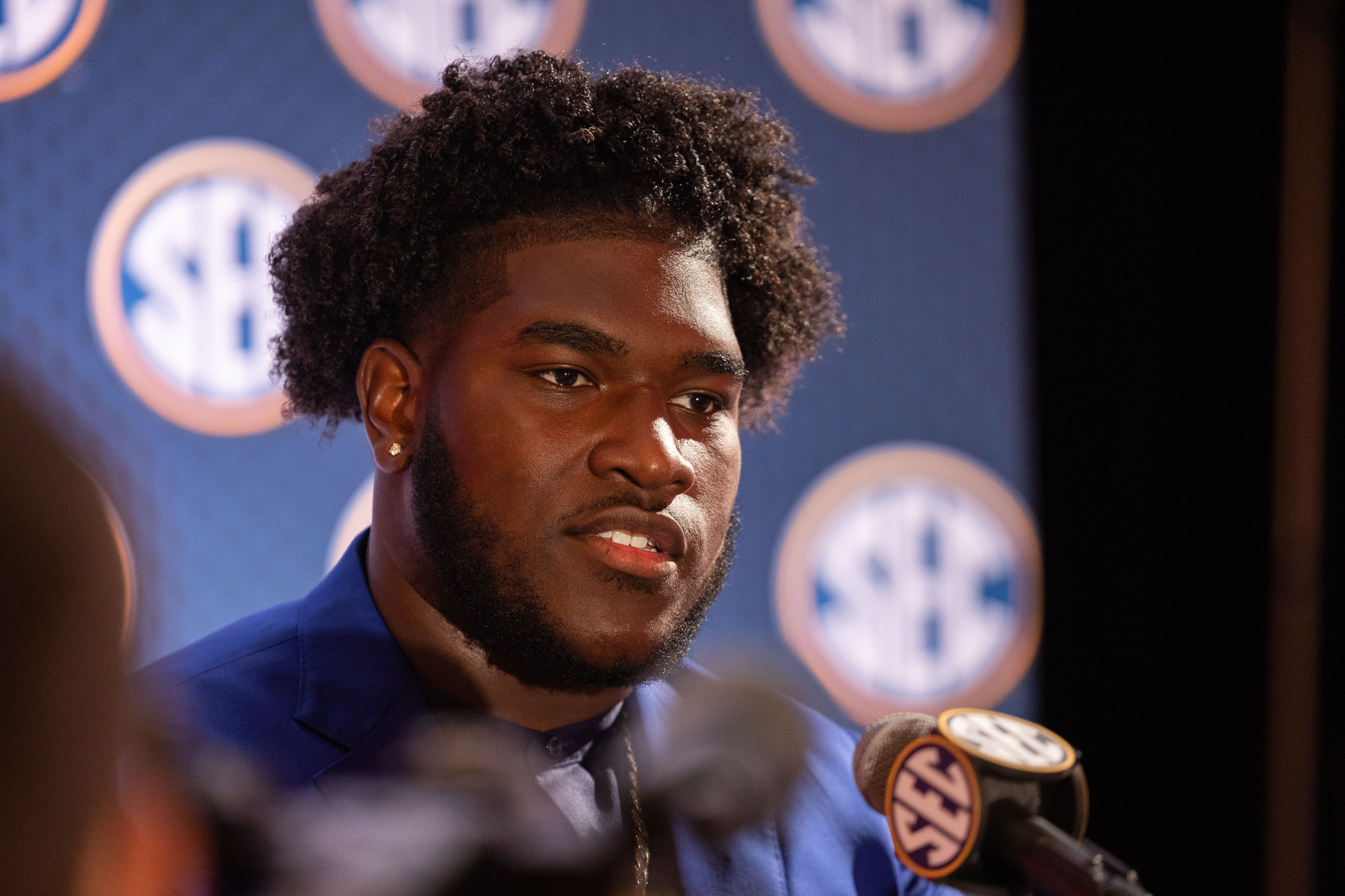 Jul 17, 2024; Dallas, TX, USA; Alabama offensive lineman Tyler Booker speaking at Omni Dallas Hotel. Mandatory Credit: Brett Patzke-USA TODAY Sports