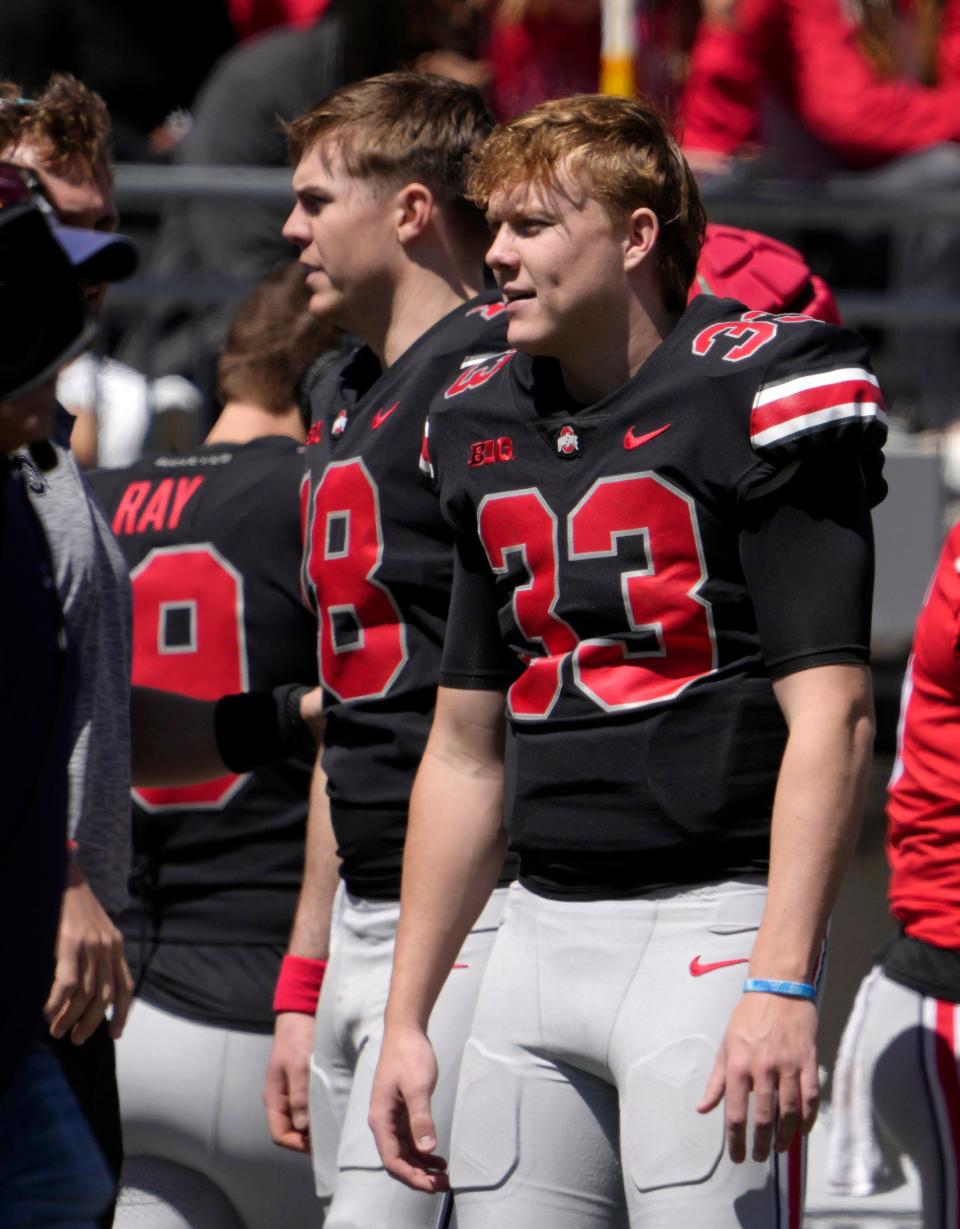 April 13, 2024; Columbus, Ohio, USA; 
Ohio State Buckeyes quarterbacks Will Howard (18) and Devin Brown (33) stand on the sideline during the second half of the LifeSports spring football game at Ohio Stadium on Saturday.