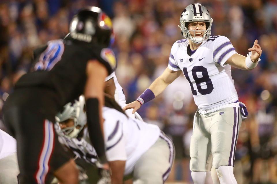 Kansas State senior quarterback Will Howard (18) calls a play during the third quarter of Saturday's Sunflower Showdown against Kansas inside David Booth Kansas Memorial Stadium.