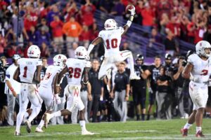 Nebraska Cornhuskers cornerback Joshua Kalu (10) celebrates an interception against the Northwestern Wildcats during the second half at Ryan Field. The Cornhuskers won 24-13. 