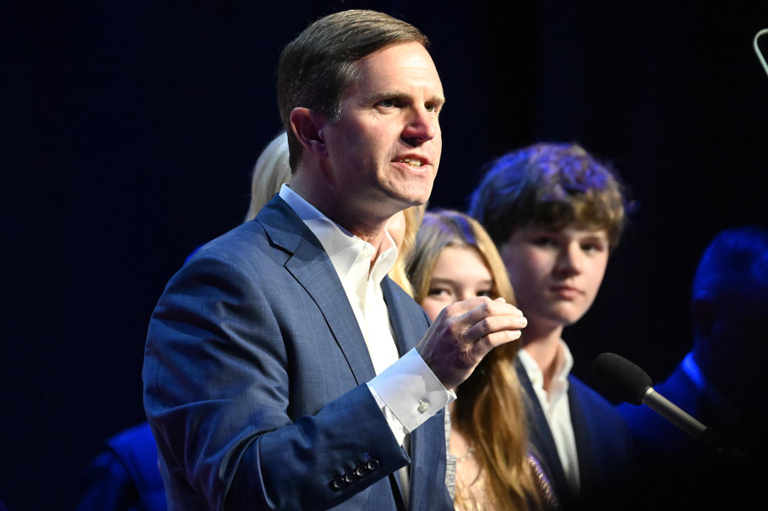 Kentucky Gov. Andy Beshear, with his family by his side, delivers his victory speech on election night in Louisville in November 2023