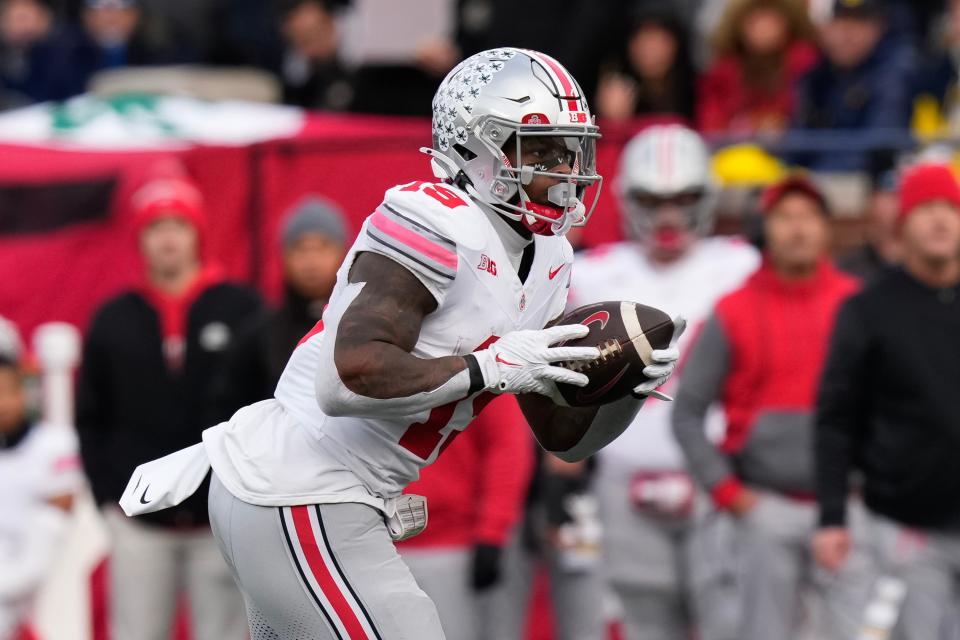 Nov 25, 2023; Ann Arbor, Michigan, USA; Ohio State Buckeyes running back Chip Trayanum (19) carries the ball during the NCAA football game against the Michigan Wolverines at Michigan Stadium. Ohio State lost 30-24.