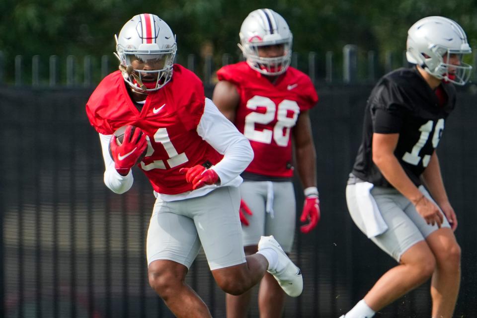 Aug 4, 2022; Columbus, OH, USA;  Ohio State Buckeyes running back Evan Pryor (21) runs during the first fall football practice at the Woody Hayes Athletic Center. Mandatory Credit: Adam Cairns-The Columbus Dispatch