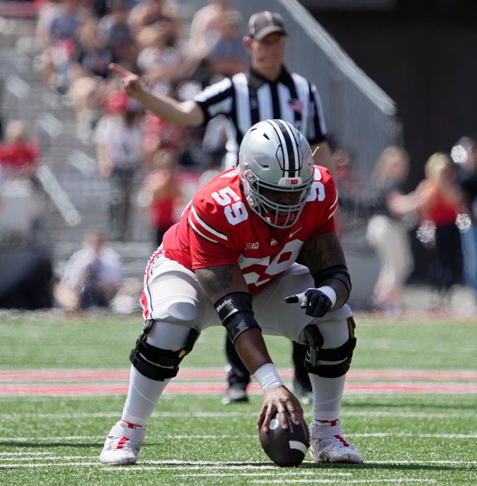 April 15, 2023; Columbus, Ohio, USA;  Offensive tackle Victor Cutler Jr. waits to snap the ball during the Ohio State spring football game Saturday at Ohio Stadium.Mandatory Credit: Barbara J. Perenic/Columbus Dispatch