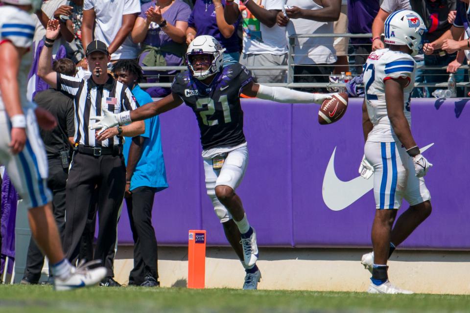 Sep 23, 2023; Fort Worth, Texas, USA; TCU Horned Frogs safety Bud Clark (21) celebrates after he intercepts an SMU Mustangs pass during the second half at Amon G. Carter Stadium. Mandatory Credit: Jerome Miron-USA TODAY Sports