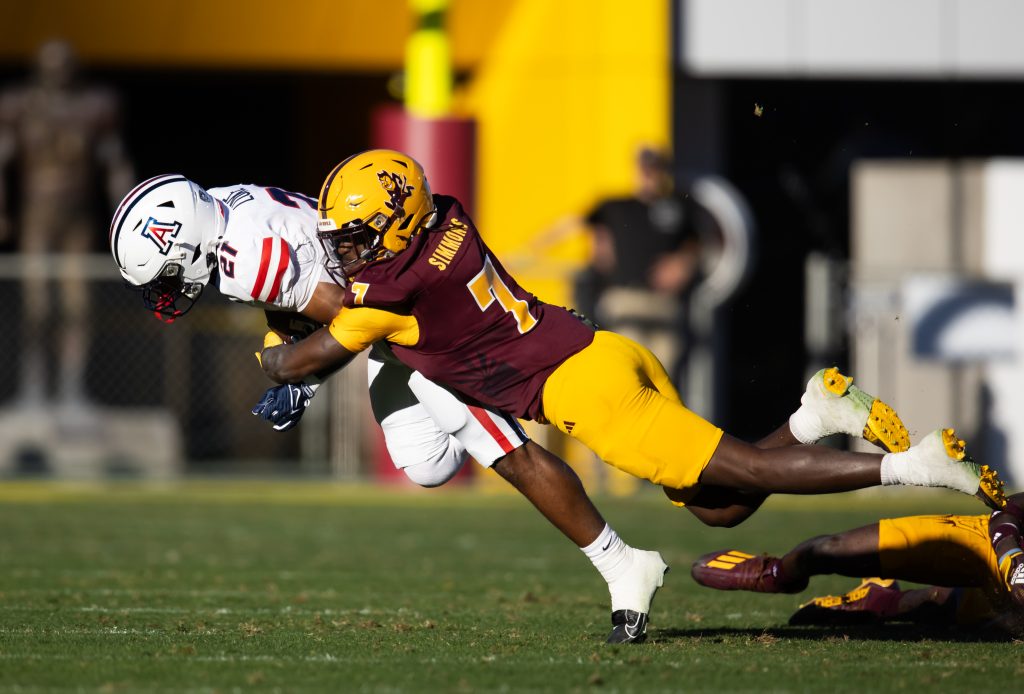 Nov 25, 2023; Tempe, Arizona, USA; Arizona State Sun Devils defensive back Shamari Simmons (7) tackles Arizona Wildcats running back Rayshon Luke (21) in the first half of the Territorial Cup at Mountain America Stadium. Mandatory Credit: Mark J. Rebilas-USA TODAY Sports