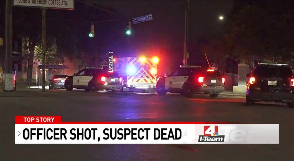 The scene of Sunday's shooting showing emergency vehicle and cops swarming an apartment complex.