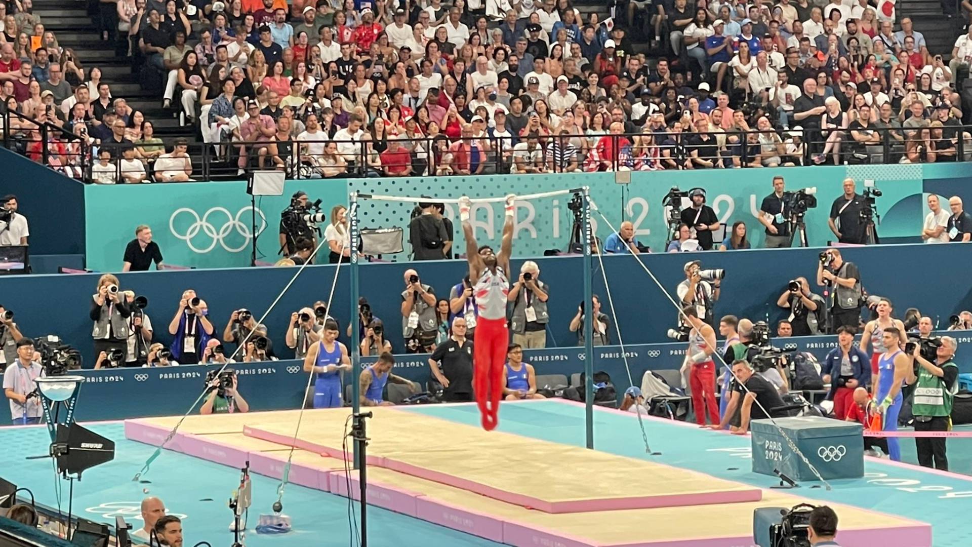 The USA's Fred Richard on the high bar during the men's team gymnastics competition in Paris on July 29, 2024.