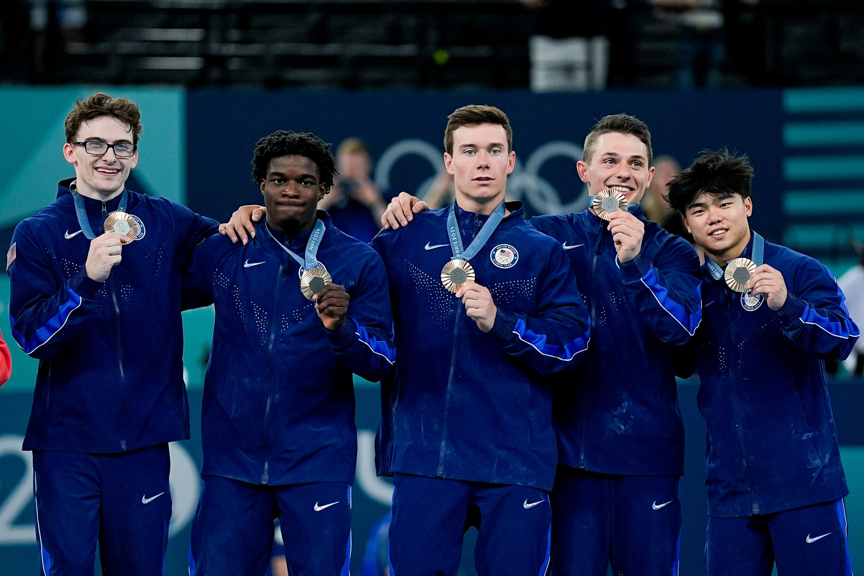 (L-R) Stephen Nedoroscik of United States, Frederick Richard of United States, Brody Malone of United States, Paul Juda of United States, Asher Hong of United States pose for a photo with their bronze medalduring the Men's Artistic Gymnastics Team Final on day three of the Olympic Games Paris 2024 at Bercy Arena on July 29, 2024 in Paris, France. (Photo by Daniela Porcelli/Eurasia Sport Images/Getty Images)