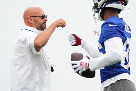 Jul 25, 2024; East Rutherford, NY, USA; New York Giants head coach Brian Daboll talks with wide receiver Darius Slayton (86) during training camp at Quest Diagnostics Training Center. Mandatory Credit: Lucas Boland-USA TODAY Sports