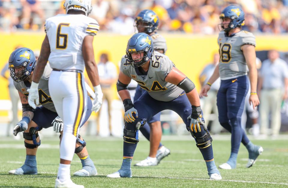 Sep 17, 2022; Morgantown, West Virginia, USA; West Virginia Mountaineers offensive lineman Wyatt Milum (64) during the second quarter against the Towson Tigers at Mountaineer Field at Milan Puskar Stadium. Mandatory Credit: Ben Queen-USA TODAY Sports