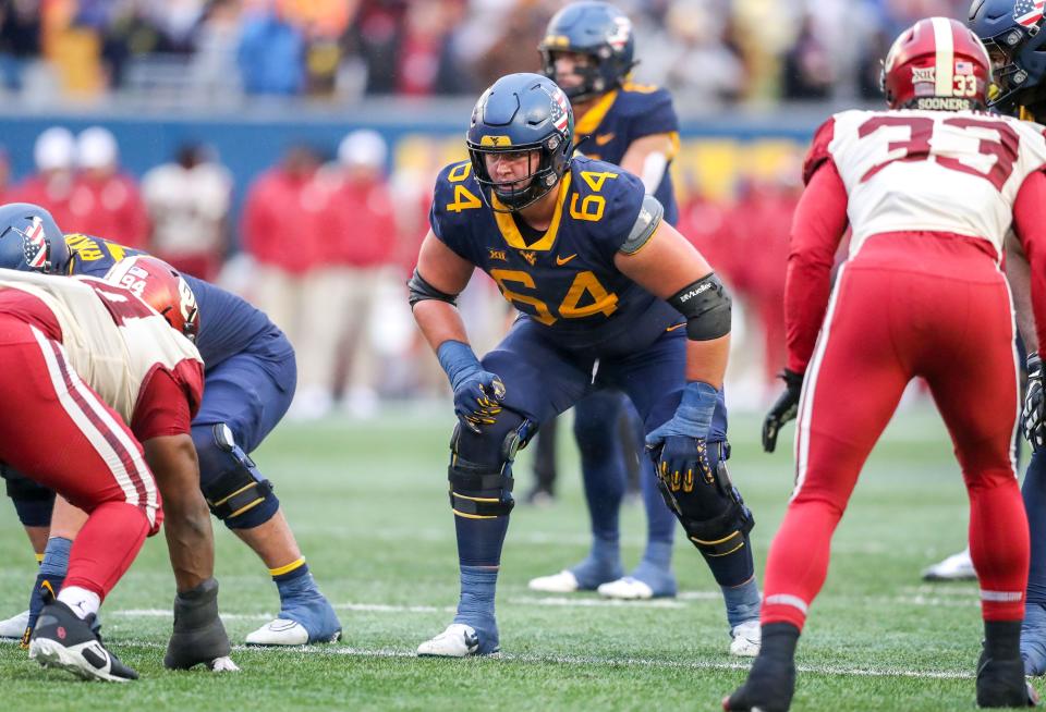 Nov 12, 2022; Morgantown, West Virginia, USA; West Virginia Mountaineers offensive lineman Wyatt Milum (64) during the third quarter against the Oklahoma Sooners at Mountaineer Field at Milan Puskar Stadium. Mandatory Credit: Ben Queen-USA TODAY Sports